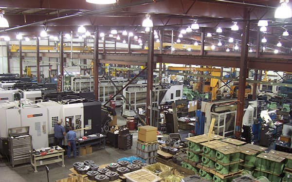 Shop floor with machining centers and pallets of finished castings