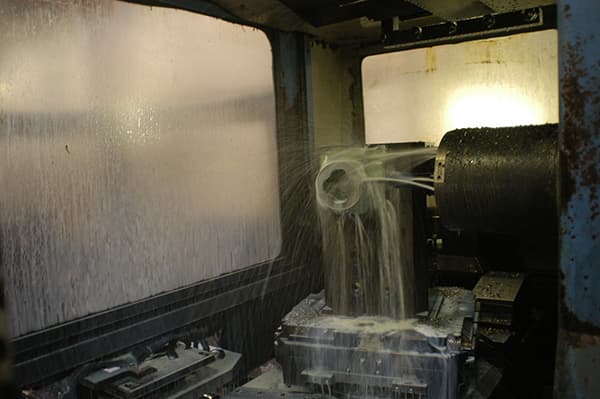 Coolant flooding a part during horizontal machining