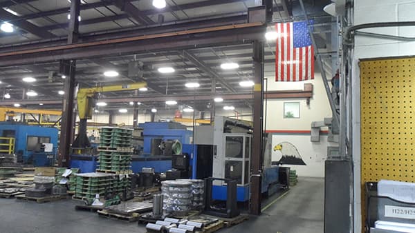 Production floor beneath an American flag