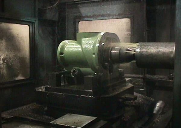 Green casting fixtured inside a horizontal machining center