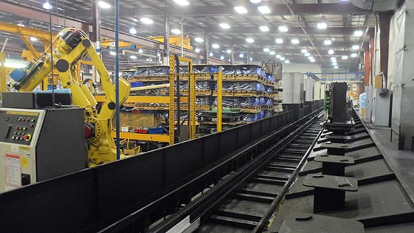 Robotic cell next to the automated FMS pallet rail